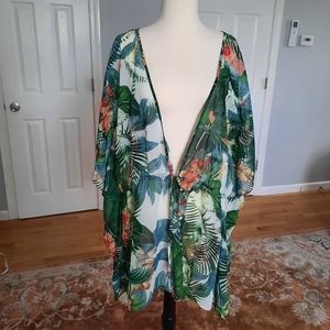 Hawaiian Tropics colorful sheer beach cover war up